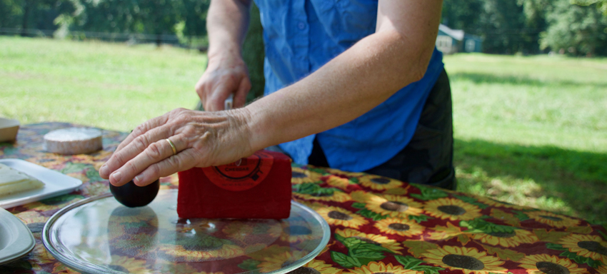 Mary slicing cheese