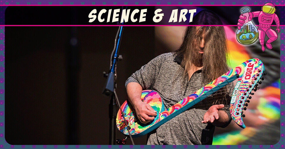 Science and Art - guy playing on colorful guitar
