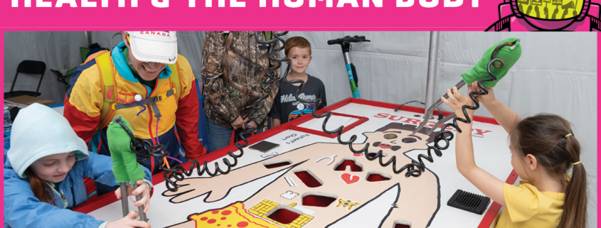 Children playing a giant game of operation