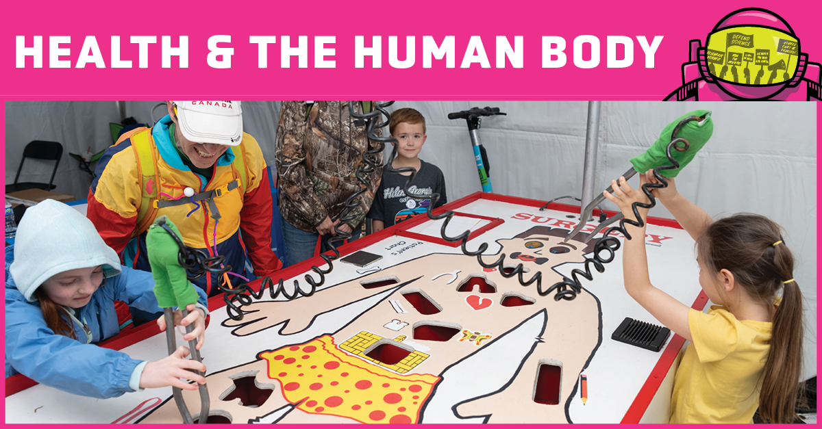 Children playing a giant game of operation