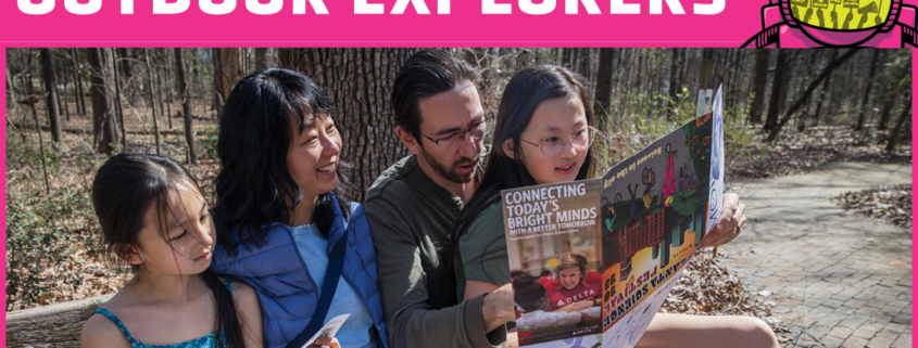Family looking at map during outdoor event
